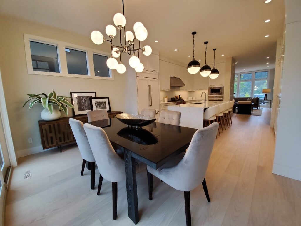 Timeless Design - kitchen and dining area with neutral colours and spherical lighting