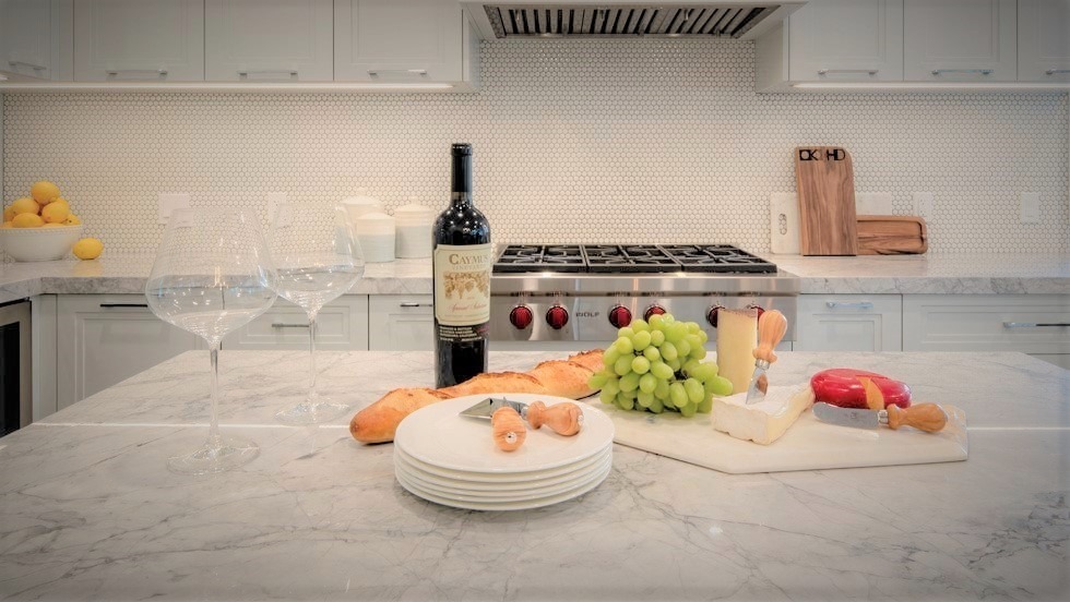 Lagom vs hygge- wine and cheese in a kitchen