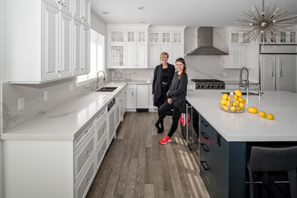 Relationship - Krista and Maggie in renovated kitchen they designed