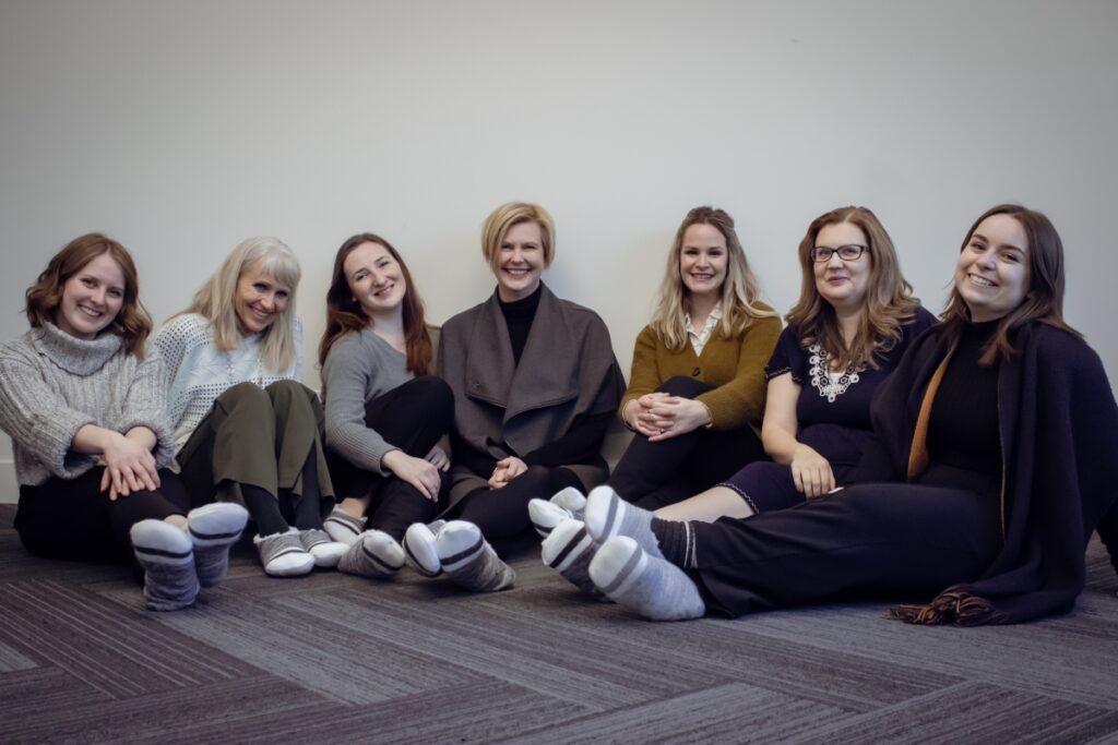 Hygge - Scandinavian Design - Group photo of KHD Team cozying up on National Hygge Day