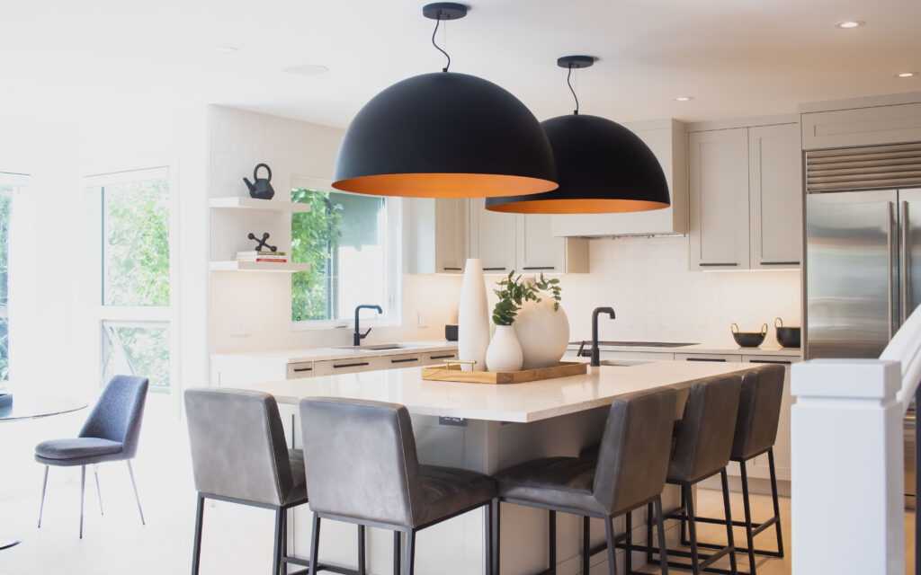Kitchen layout - kitchen with statement large dome lighting over island, one open shelving unit and cabinetry throughout
