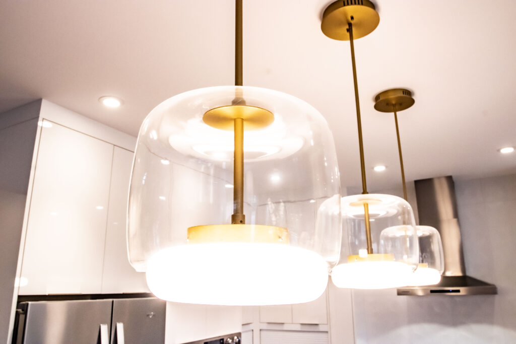 Kitchen layout - island lighting. Gold inner with cylindrical glass casing