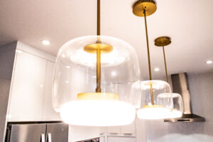 Kitchen layout - island lighting. Gold inner with cylindrical glass casing