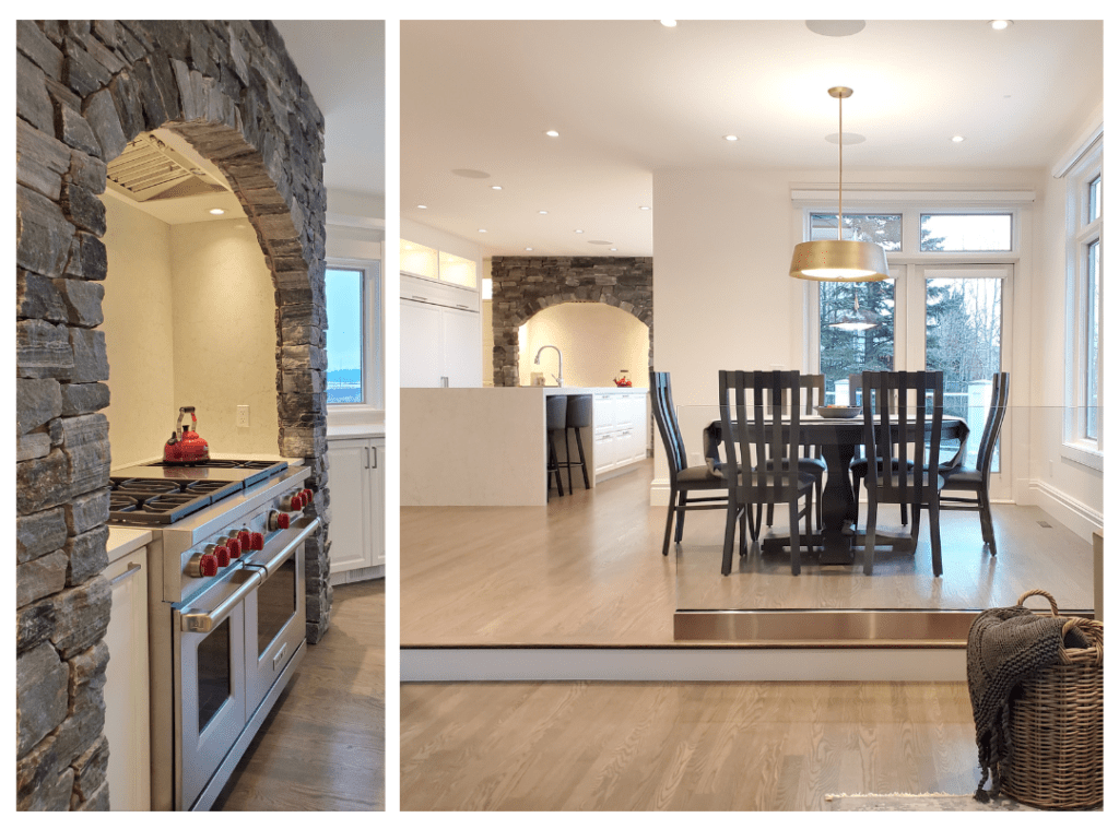 2023 Design Trends - #2 Architectural details. Stone arch over a gorgeous gas range in a pristine large white kitchen.