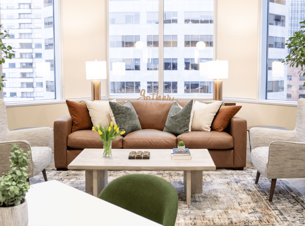 2023 Design Trends #3 - Caramel couch and accent chairs in sitting area.